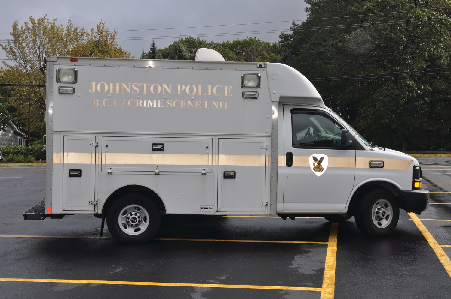TIRED APPEARANCE: This GMC Savana utility van used by Johnston Police detectives, pictured several years ago, was in desperate need of an exterior restoration.